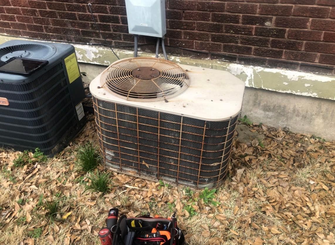 Old Rusted AC Unit Swapped Out for a Brand New Goodman image